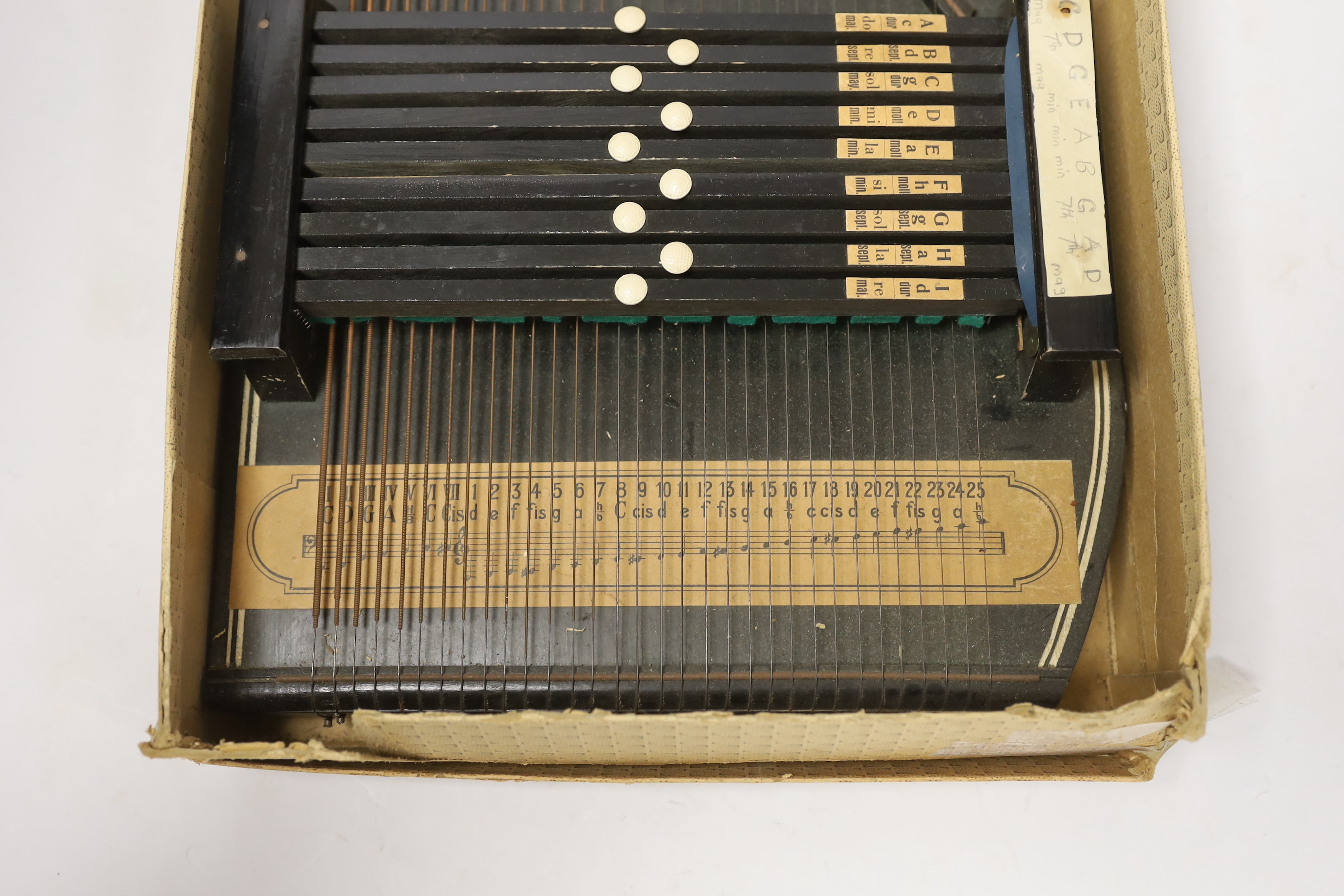 An autoharp in original box with booklet